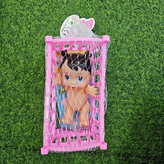 MUÑECA EN CUNA